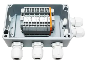 The efabox with holes, cable bushings, and terminal strips.